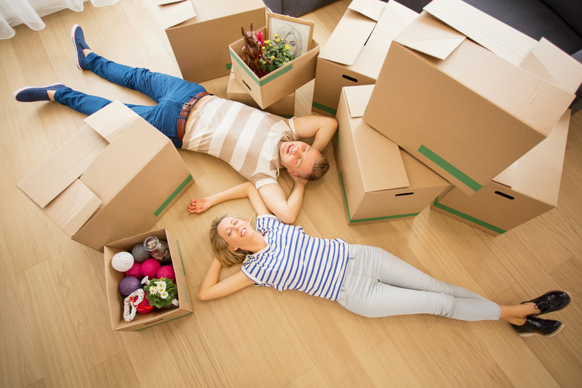 Couple lying on the floor in their new apartment